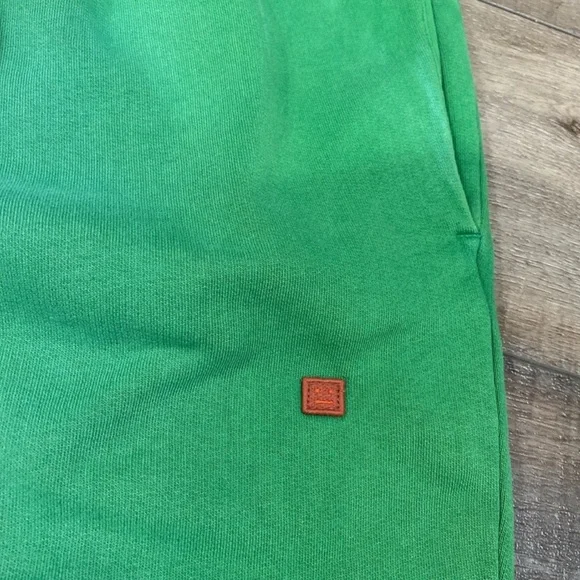 Acne Studios faded green appliqué cotton jersey track pant sweatpants